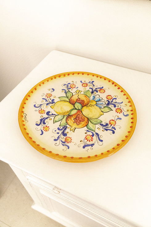 Round yellow pomegranate plate